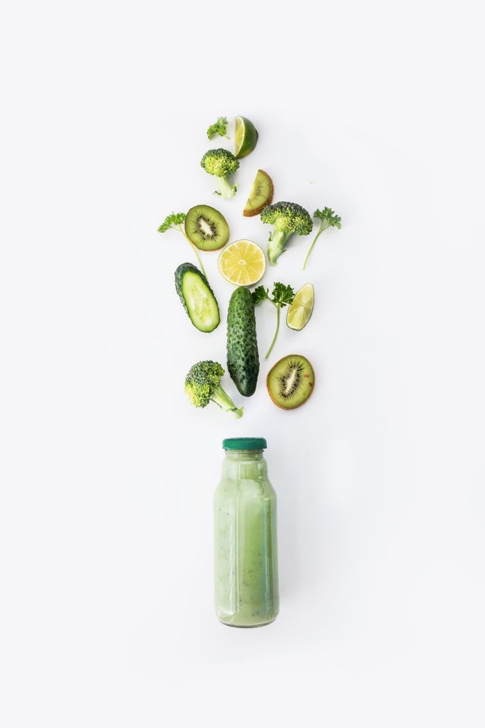 Refreshing green smoothie made with cucumber, kiwi, broccoli, and lemon.