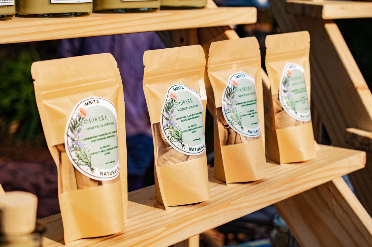 Natural herbal supplements displayed at a market in Manzini, Eswatini, highlighting local culture.